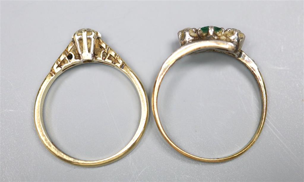 An 18ct and plat, emerald and diamond set three stone crossover ring, with diamond set shoulders and a 9ct & diamond ring.